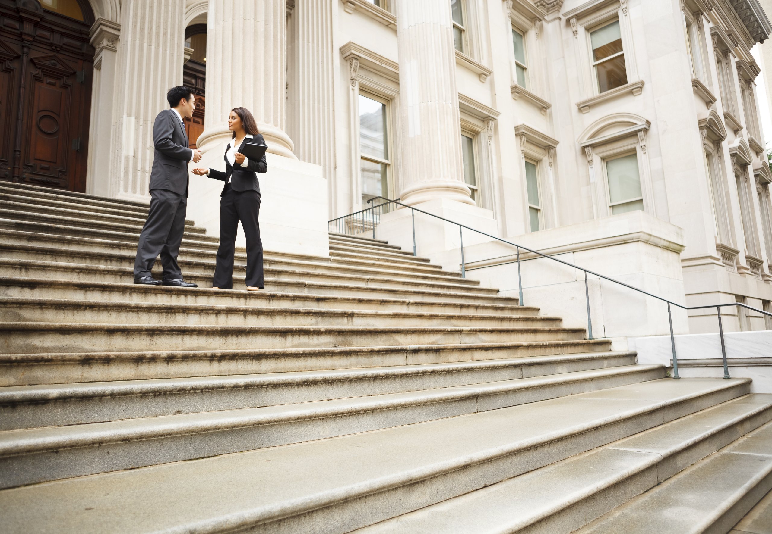 Man and woman talking on the stairs
