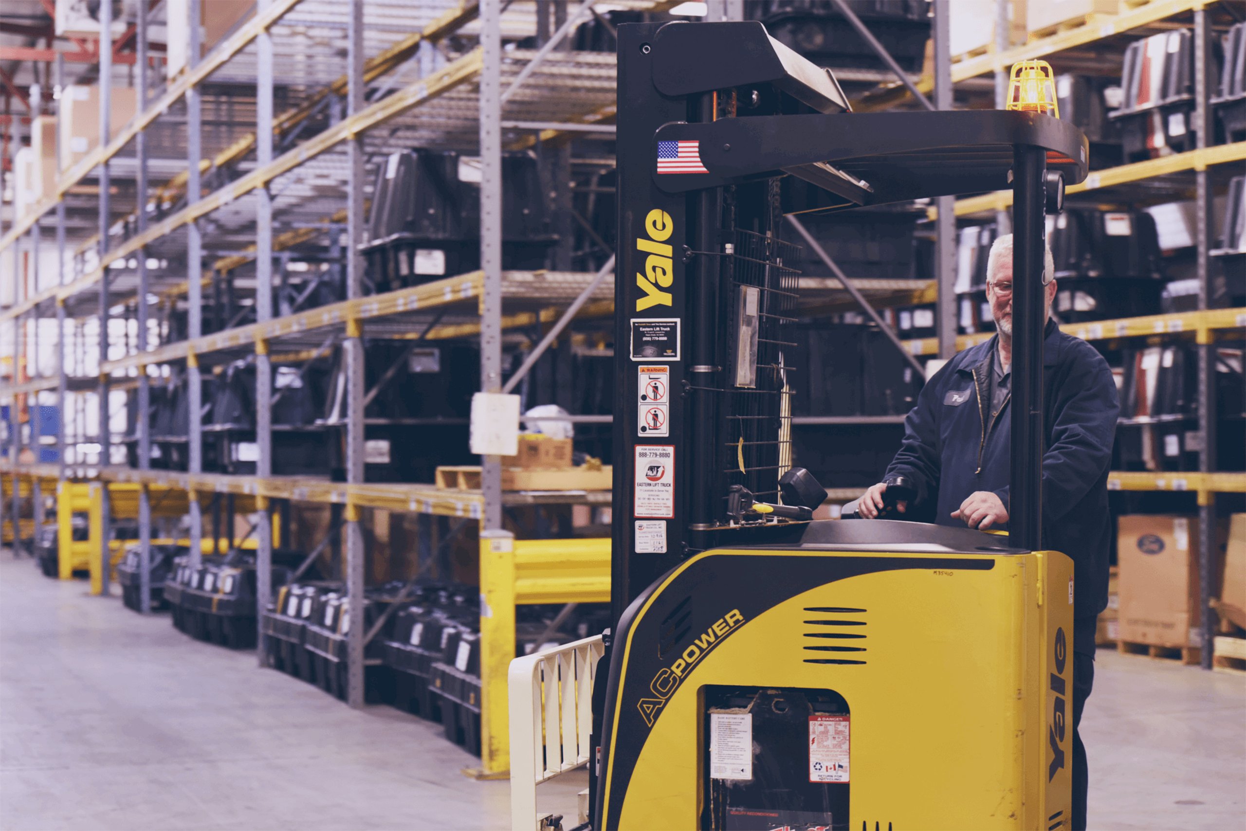 a man standing in a warehouse
