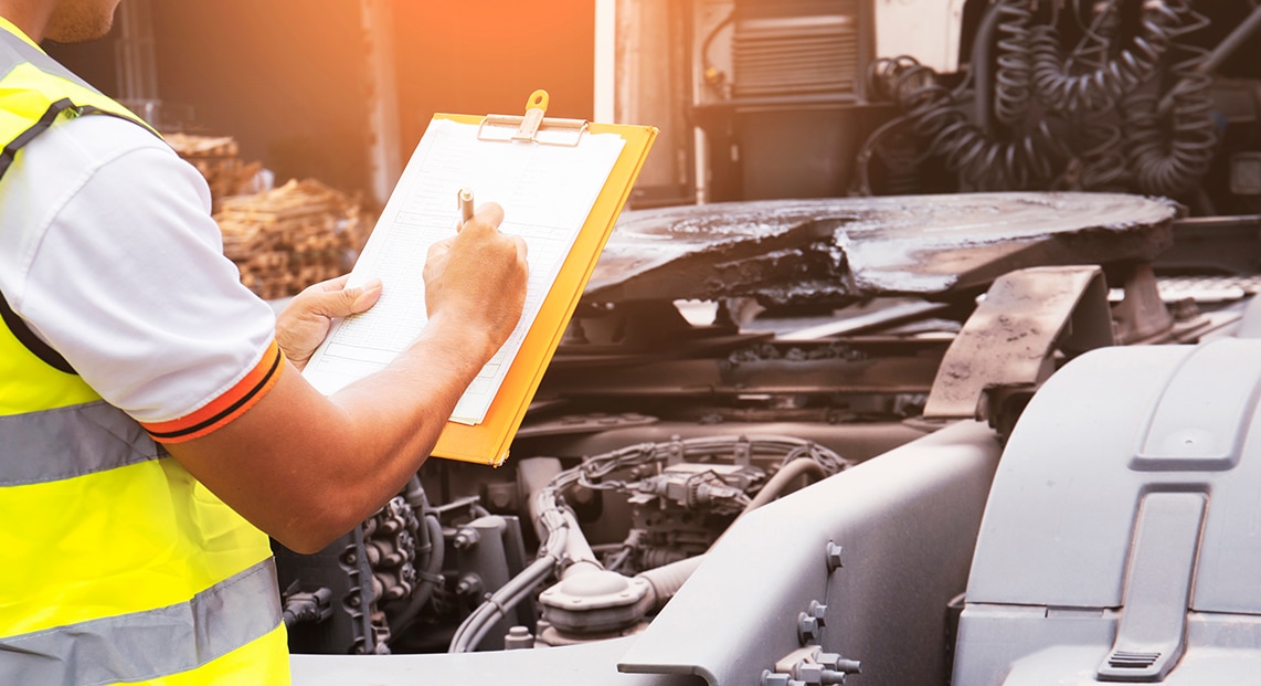 a person writing on a clipboard