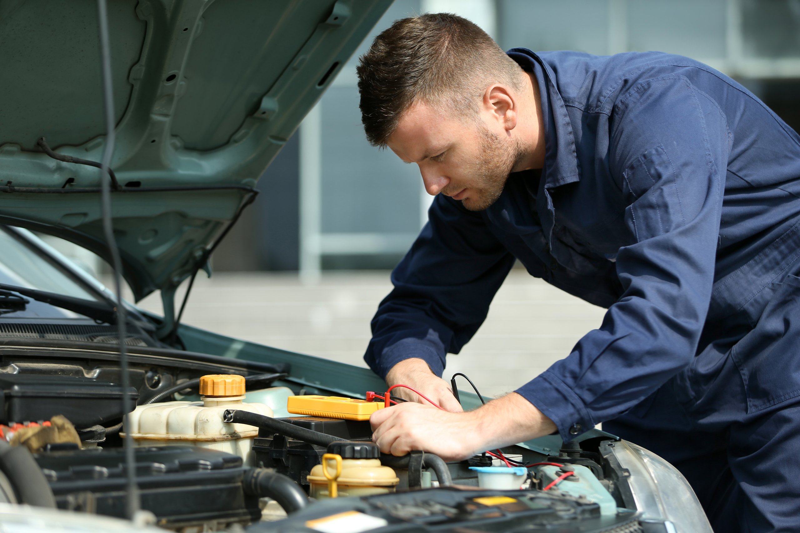 a man working on a car