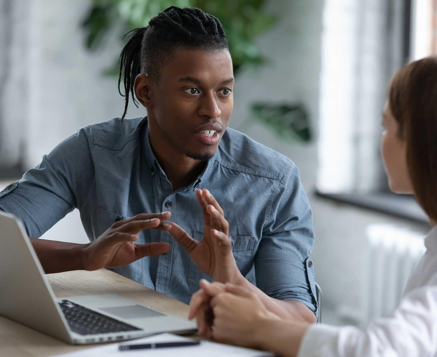 Holman employees discussing work in the office