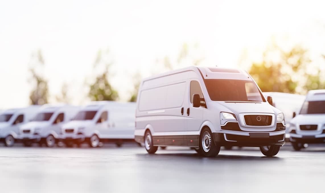 a group of white vans