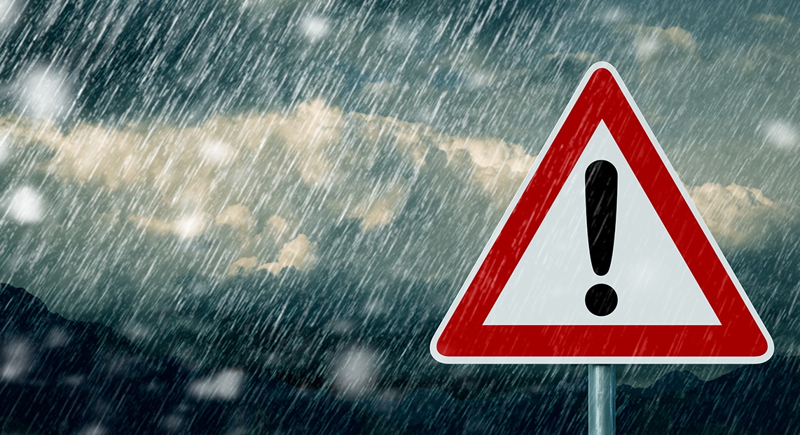 a red and white sign with a black exclamation mark on it