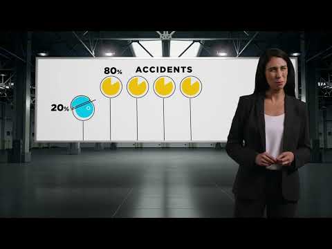 a woman standing in front of a white board