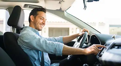 a man driving a car