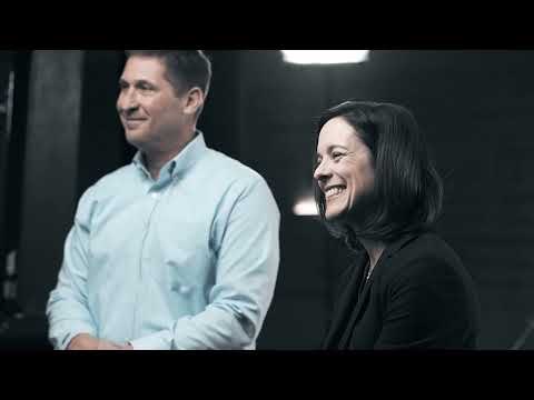 a man and woman smiling