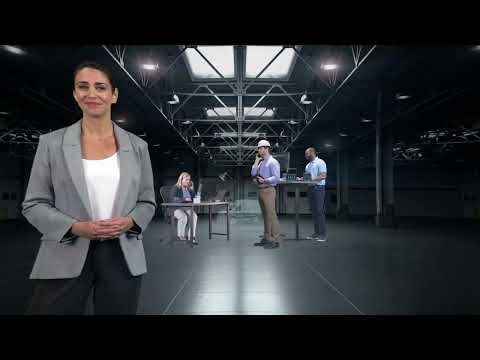 a woman standing in a room with people in the background