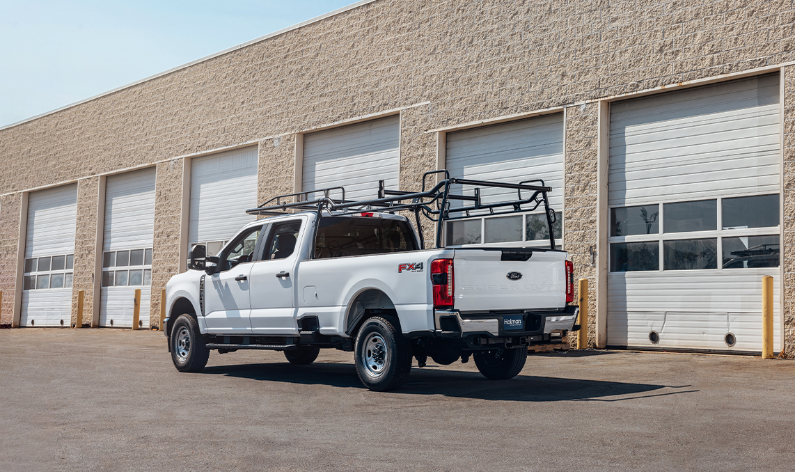 a white truck with a rack on top of it