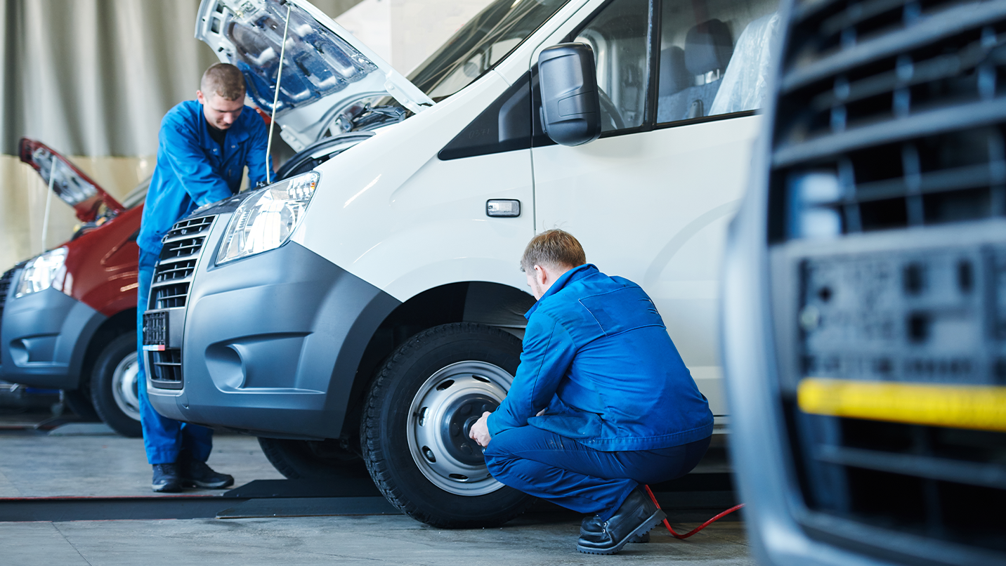 service technicians working on a fleet van