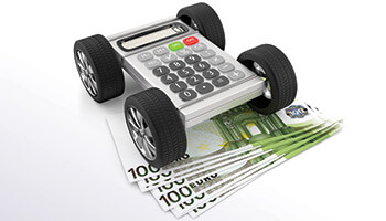 a calculator on a pile of money