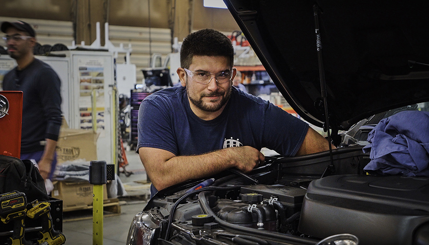 a man working on a car