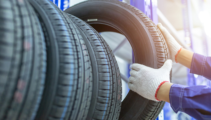 a person holding a tire