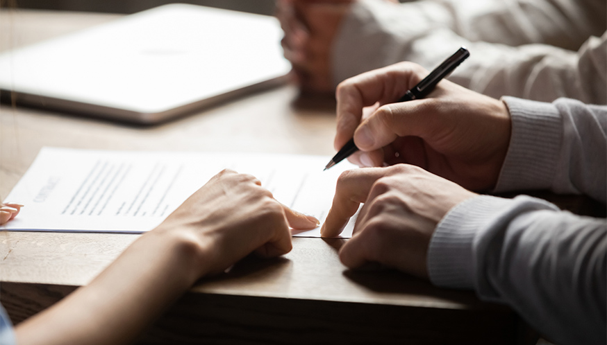 a person signing a document