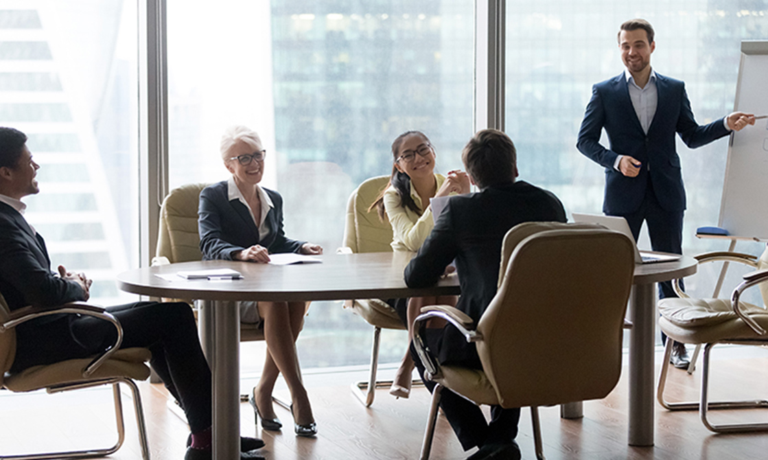 a group of people sitting at a table