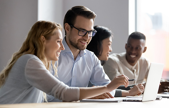 a group of people sitting at a table