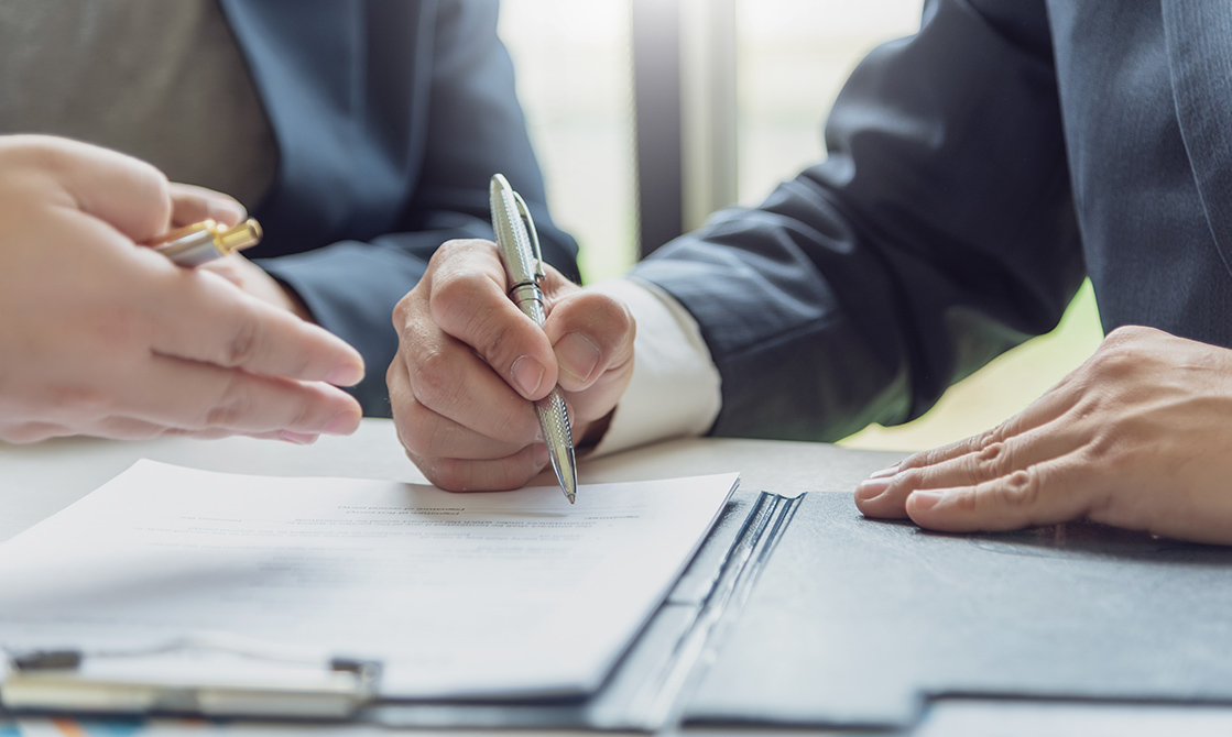 a person signing a document