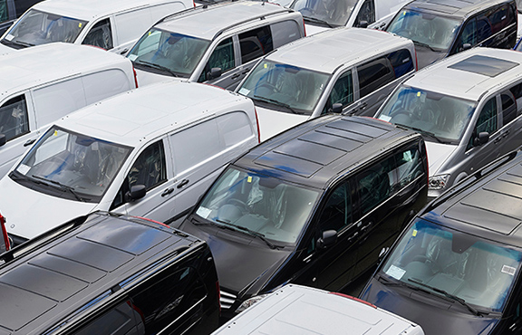 a group of cars parked in a parking lot