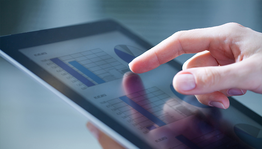 a finger pointing at a touch screen device