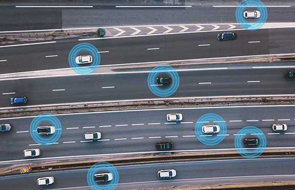 cars on a road with blue circles