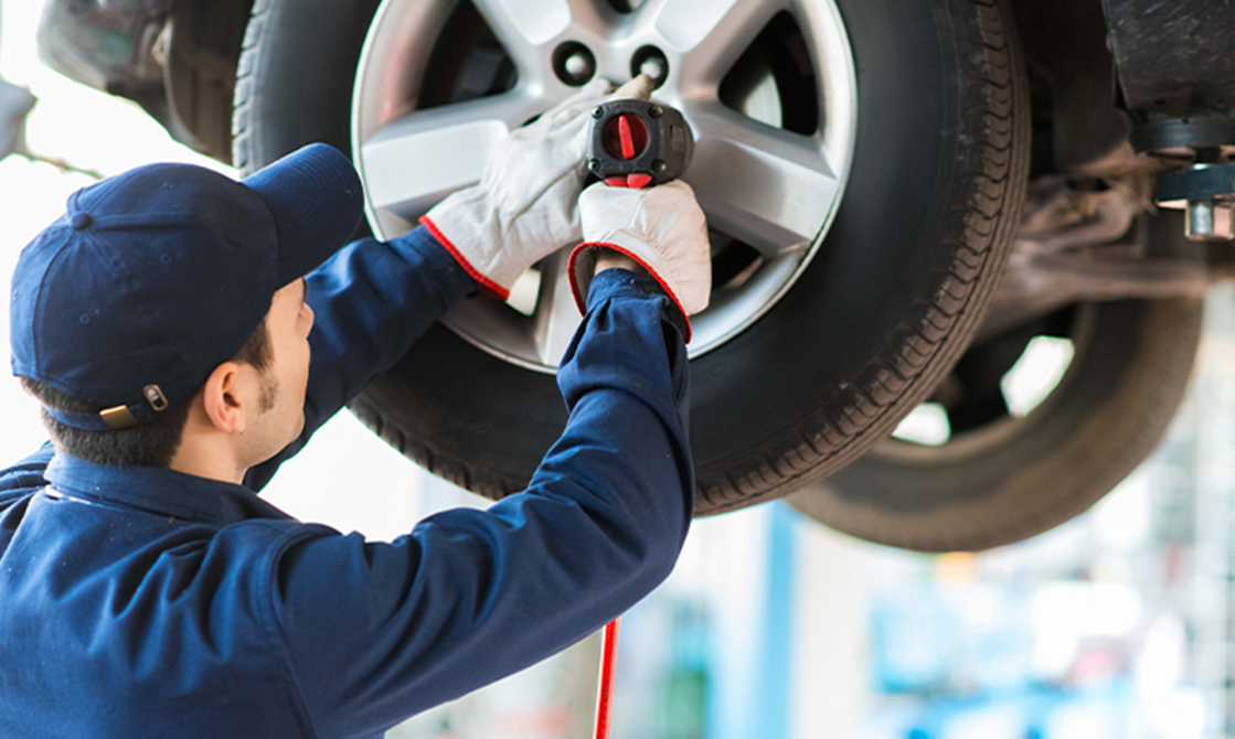 a man working on a tire