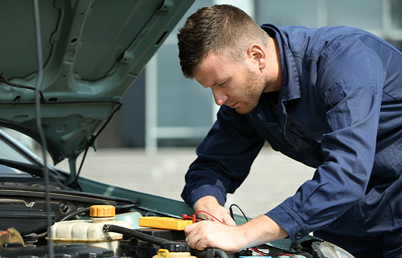 a man working on a car