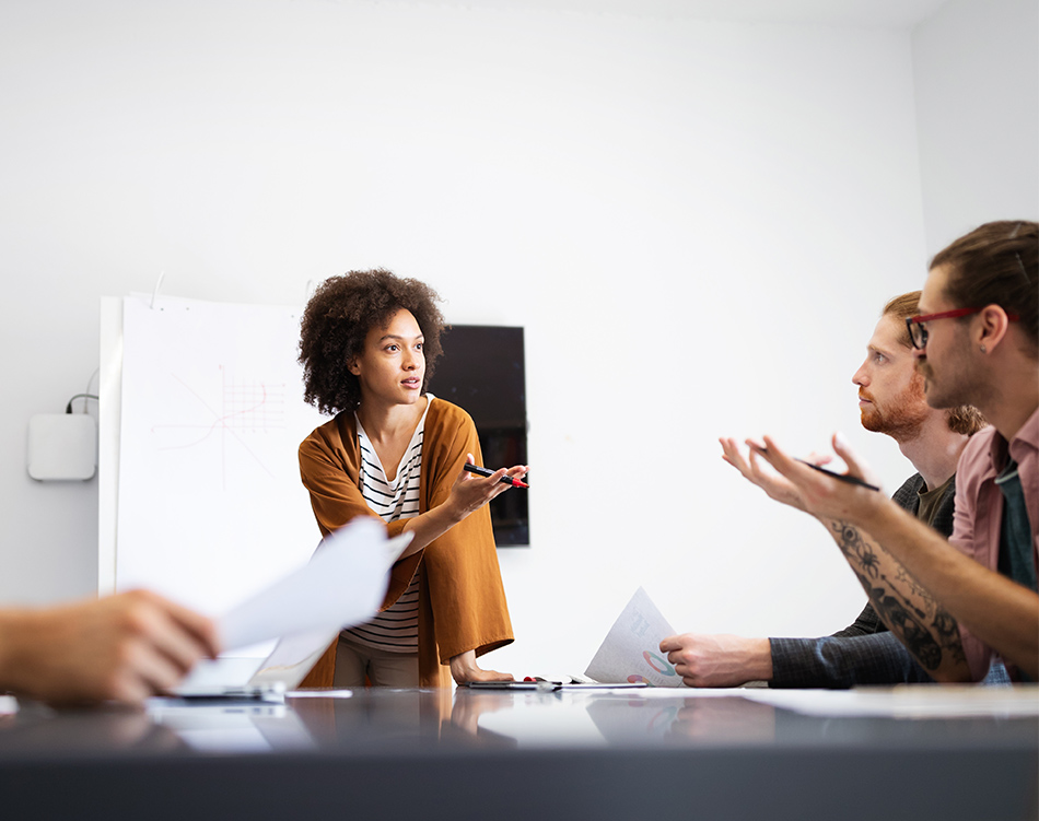 a woman standing in front of a group of people