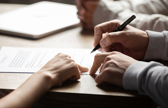 a person signing a document