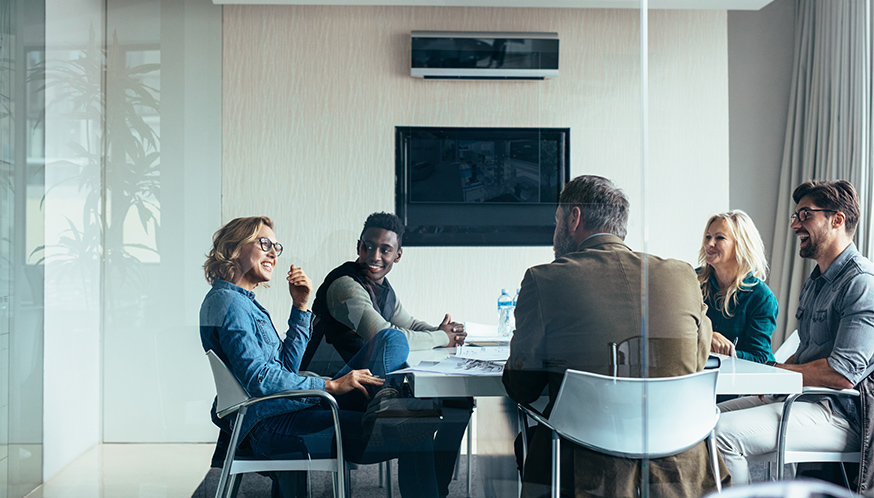 a group of people sitting at a table
