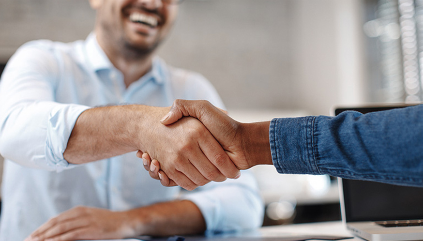 a close-up of people shaking hands