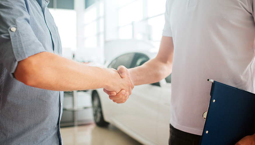 a close-up of a man shaking hands