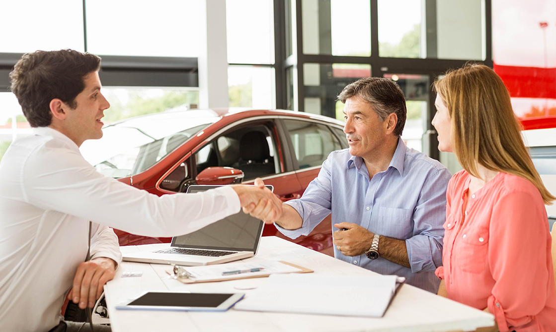 a man shaking hands with a woman