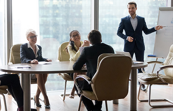 a group of people sitting around a table