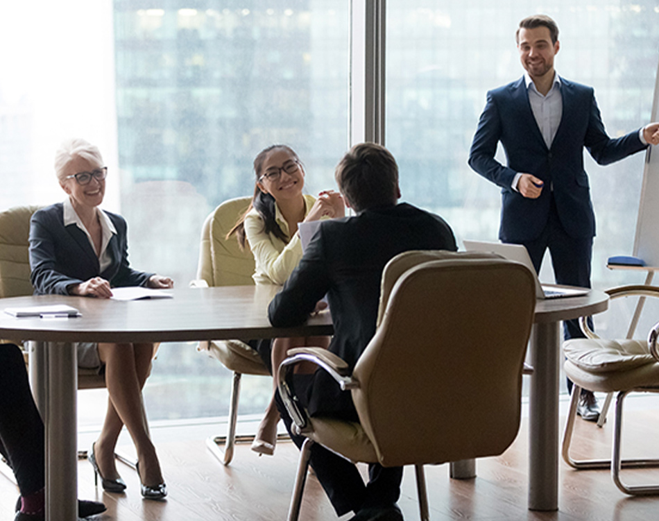 a group of people sitting around a table