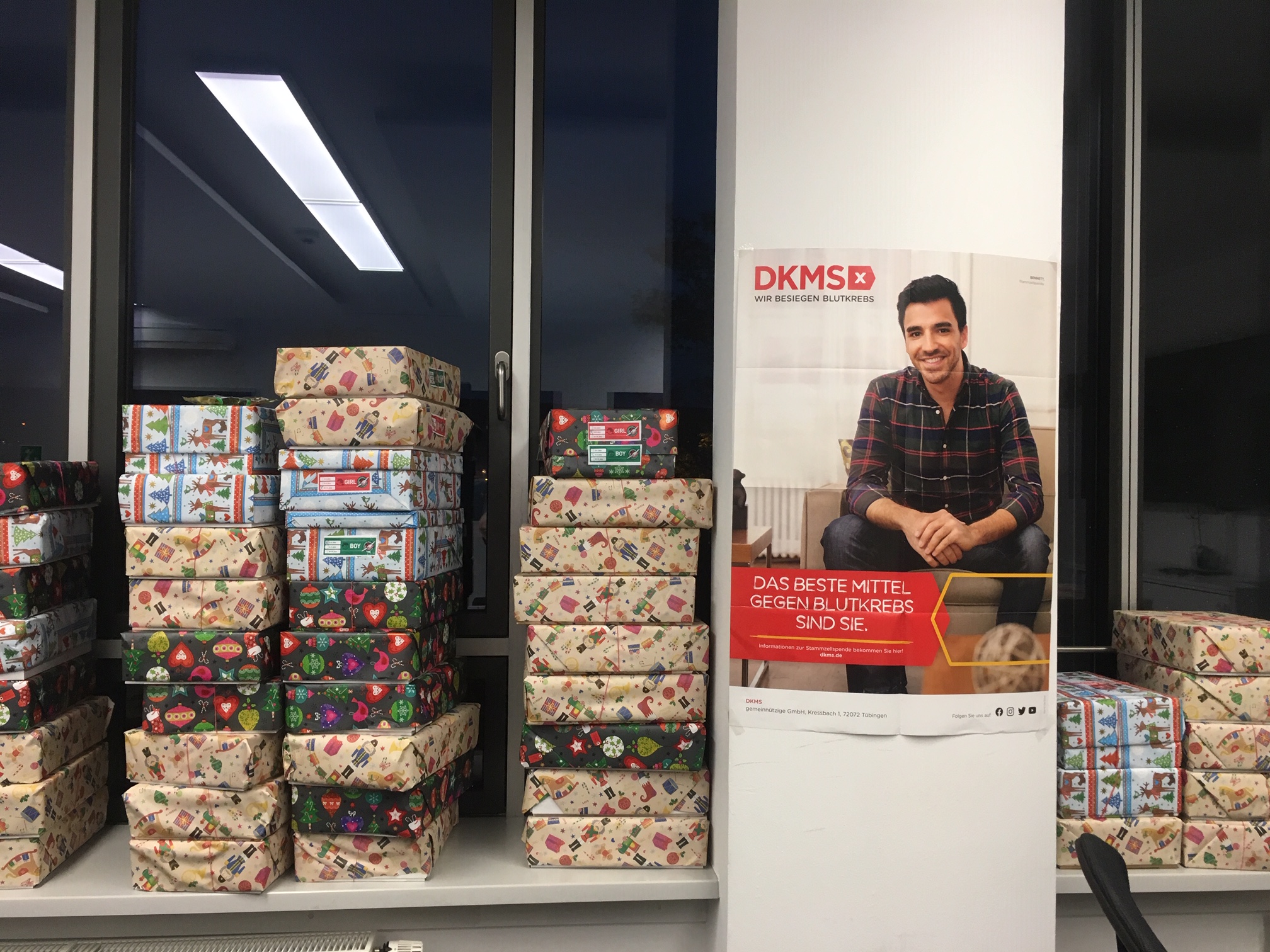 a stack of presents on a shelf