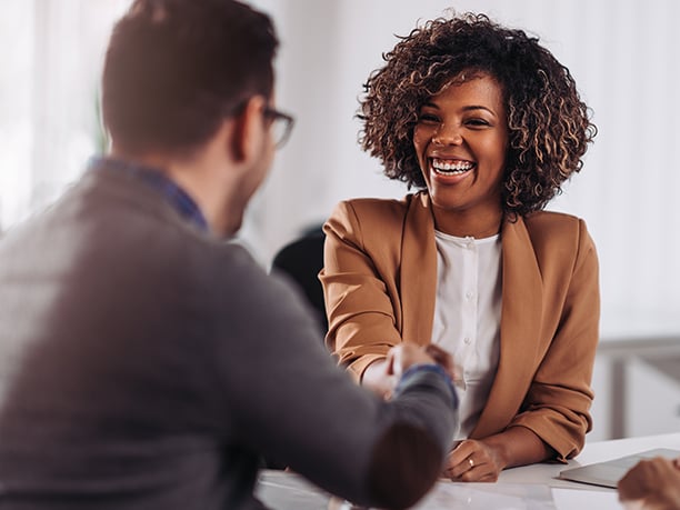 a man and woman shaking hands