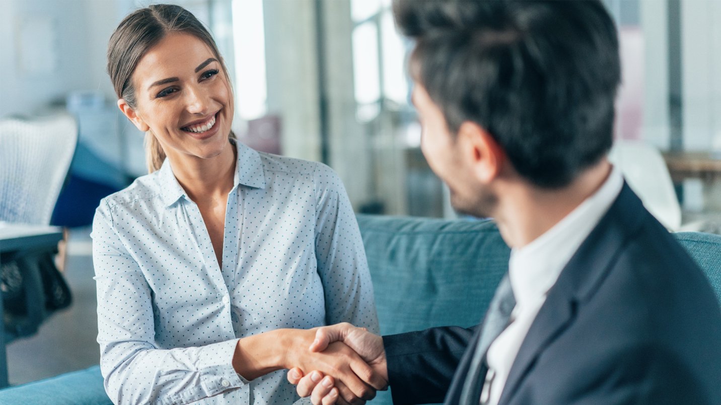 a man and woman shaking hands