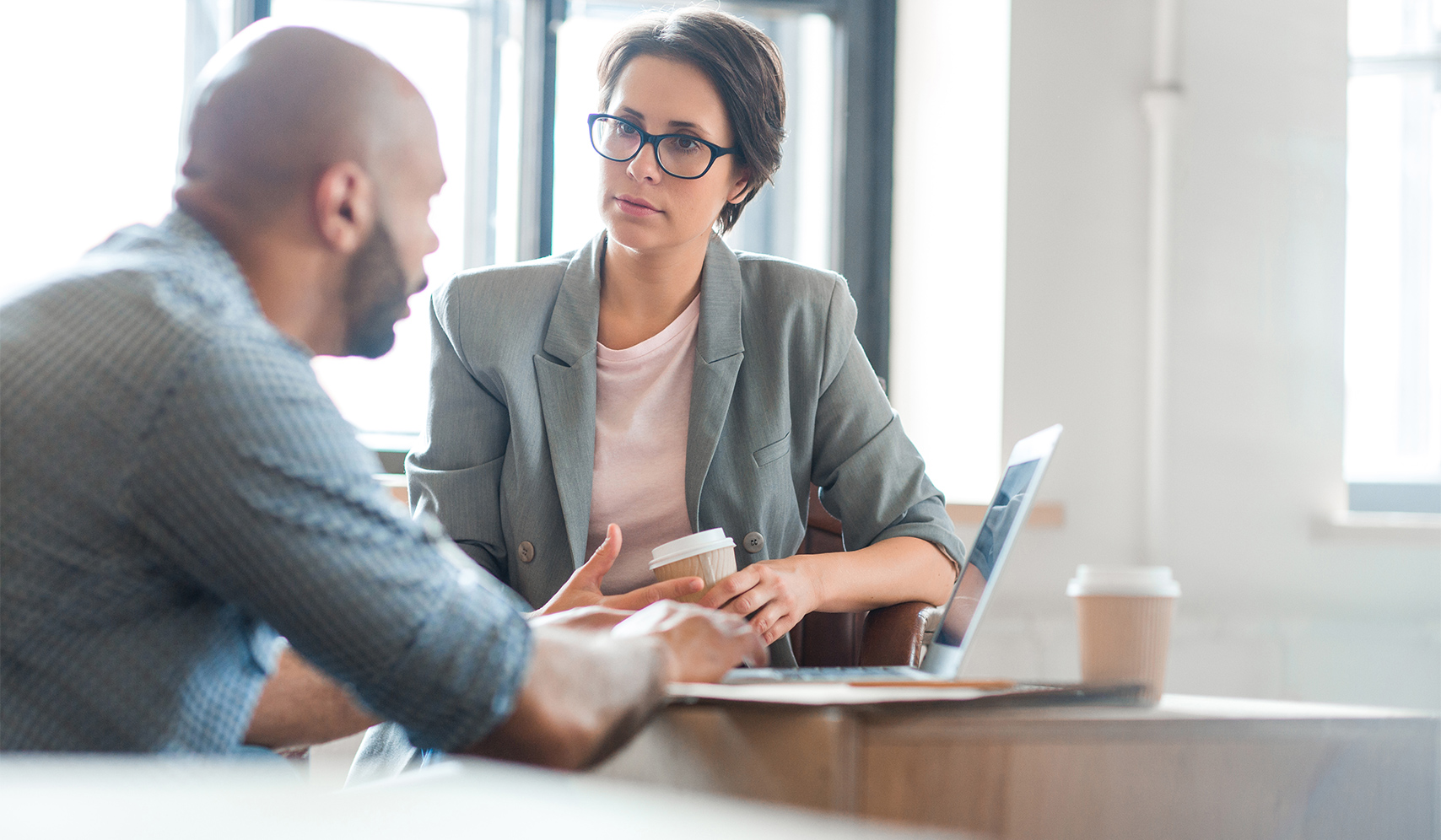a man and woman sitting at a table