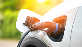 An electric vehicle being charged