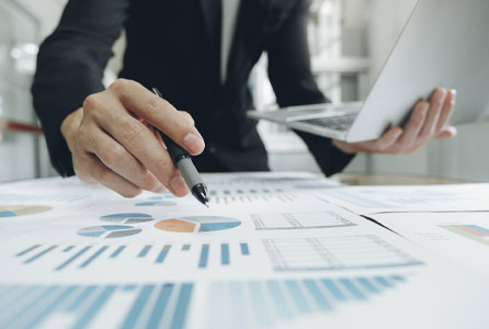 A person looking at fleet leasing data chars