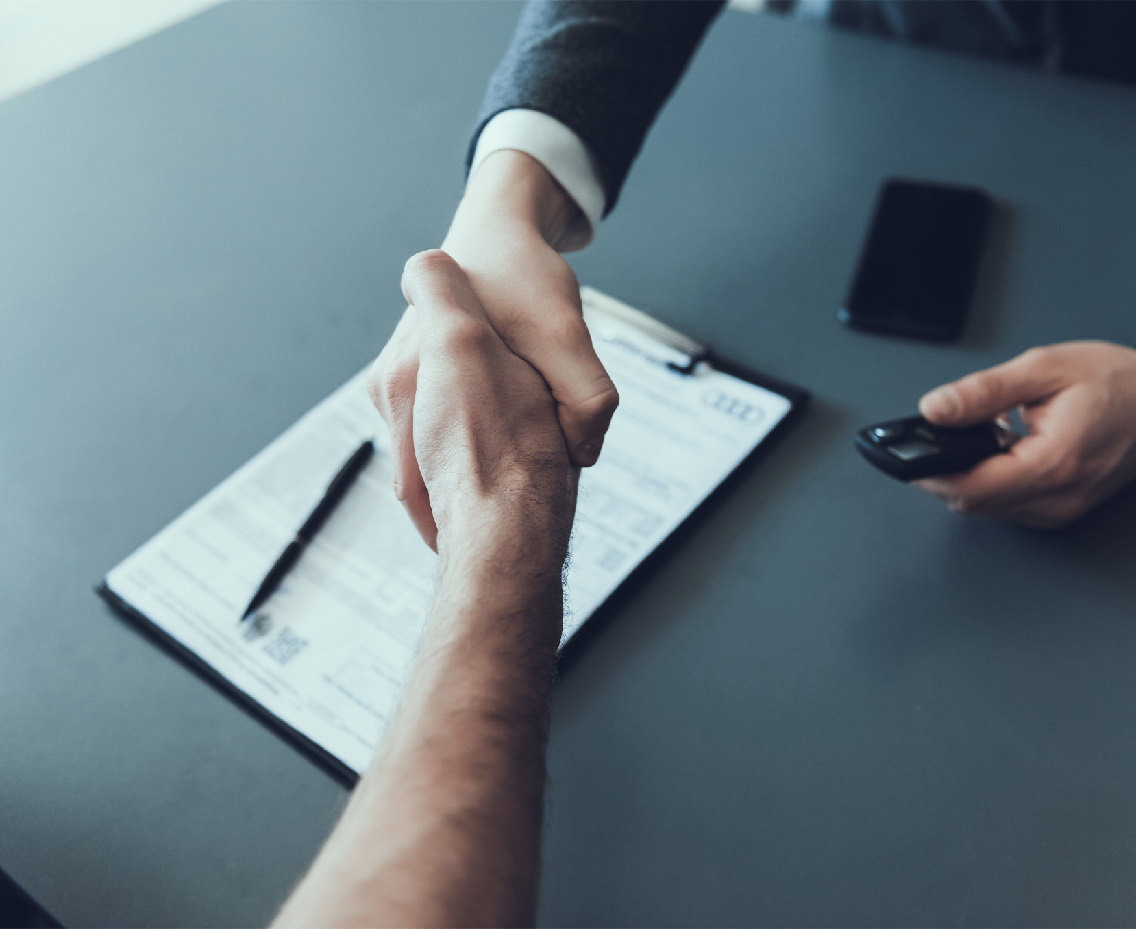 a close-up of a man shaking hands
