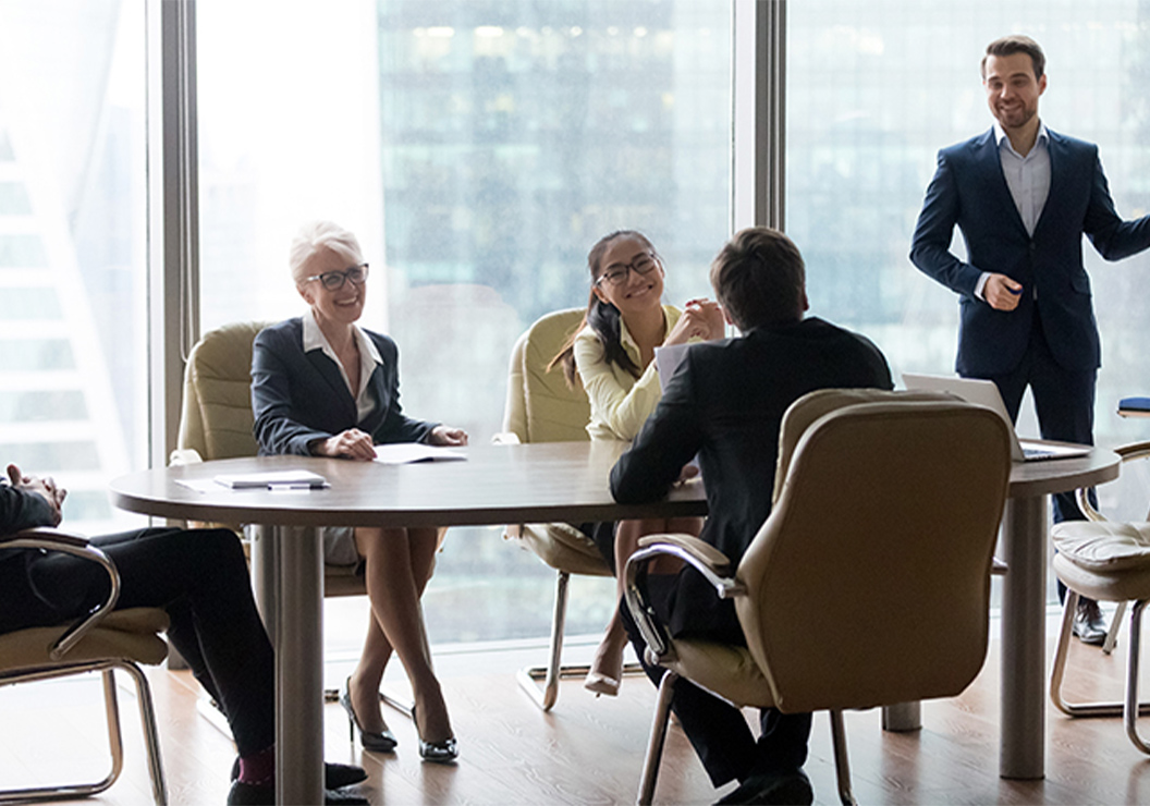 a group of people sitting at a table