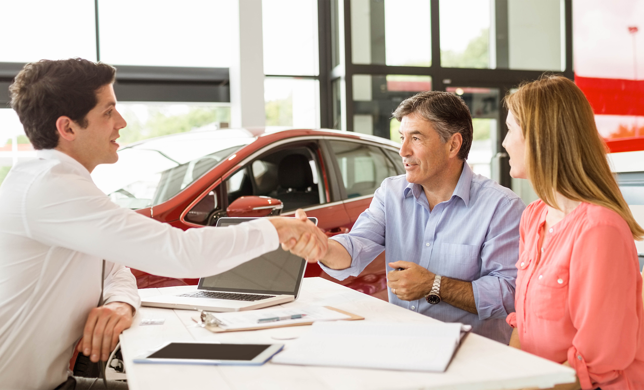 a man shaking hands with a woman