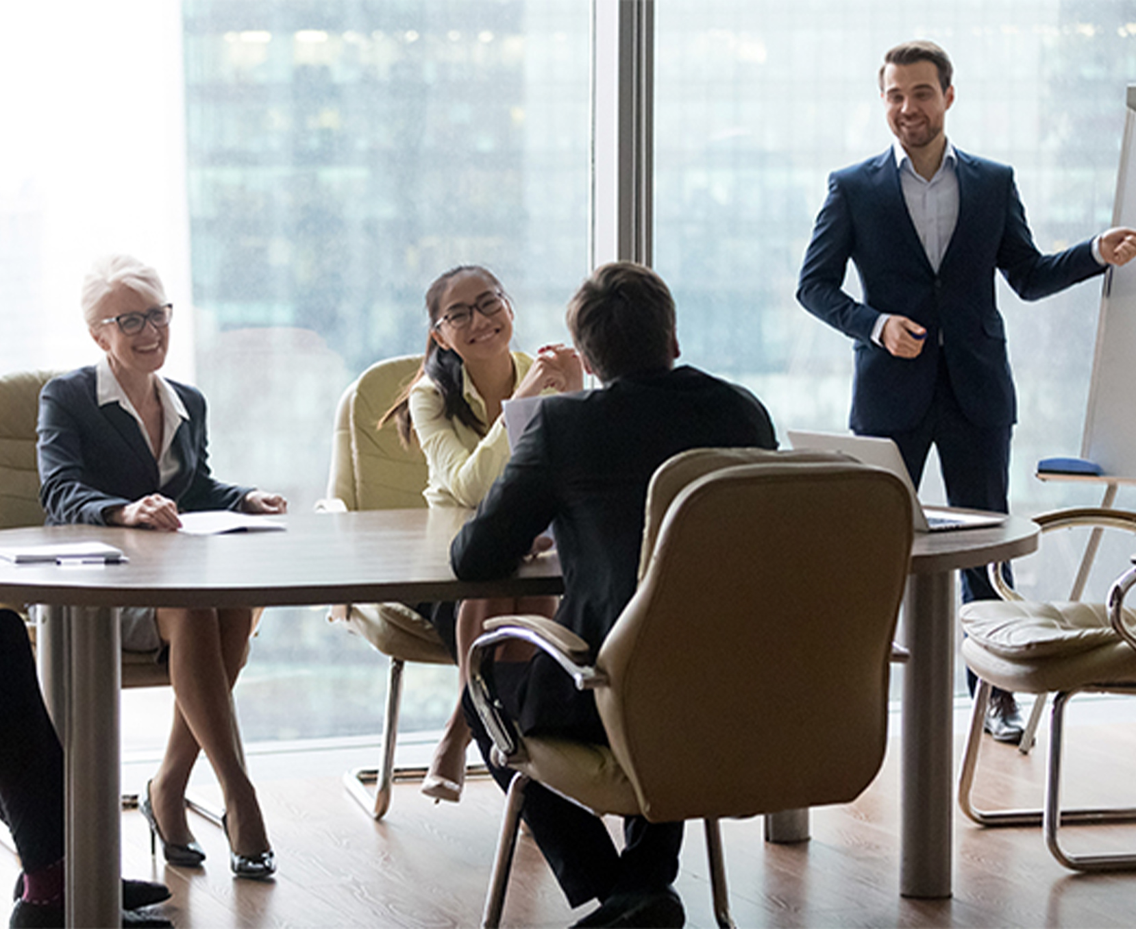 a group of people sitting around a table