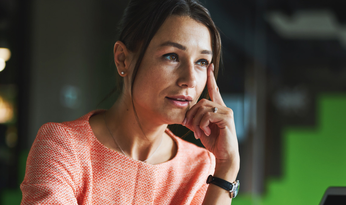 a woman with her hand on her face