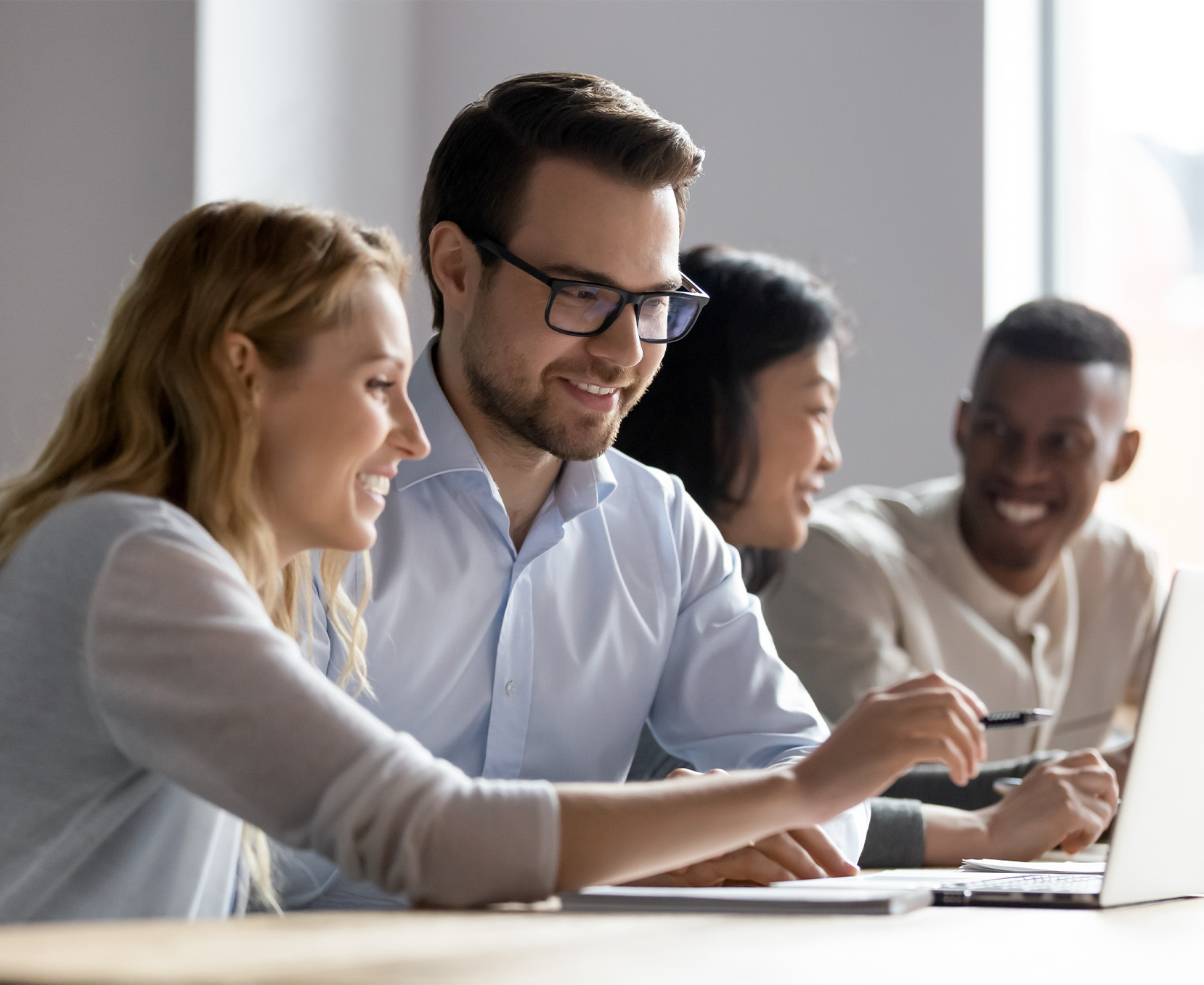 a group of people sitting at a table