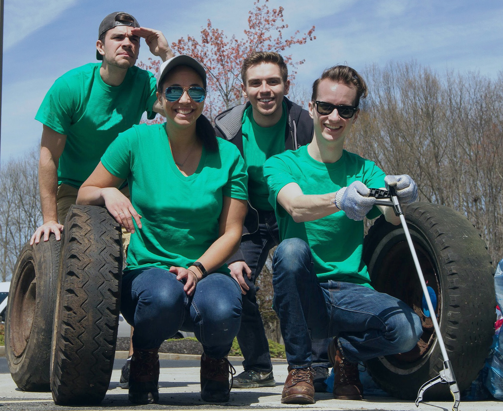 a group of people in green t-shirts