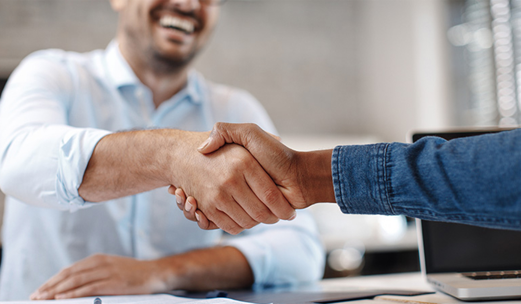 a close-up of people shaking hands