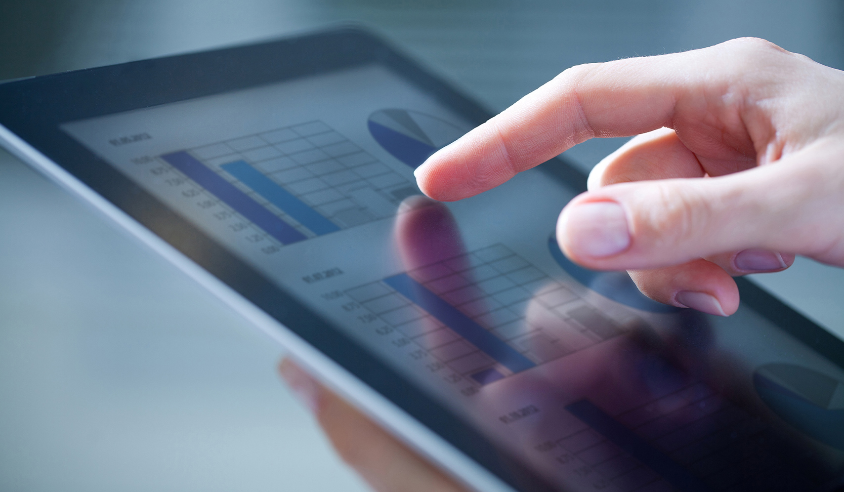 a person touching a tablet