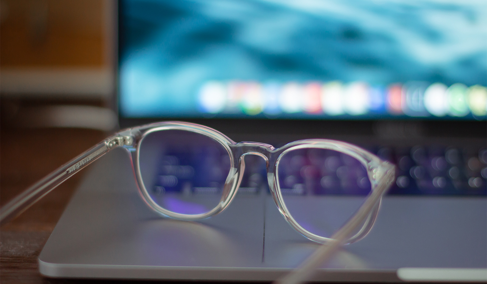 a pair of clear glasses on a laptop