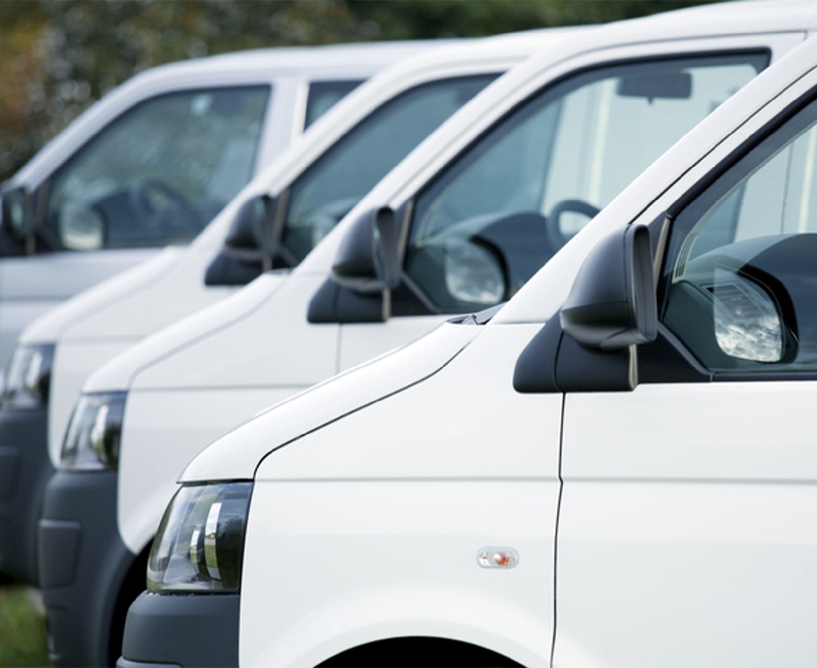 a row of white vans